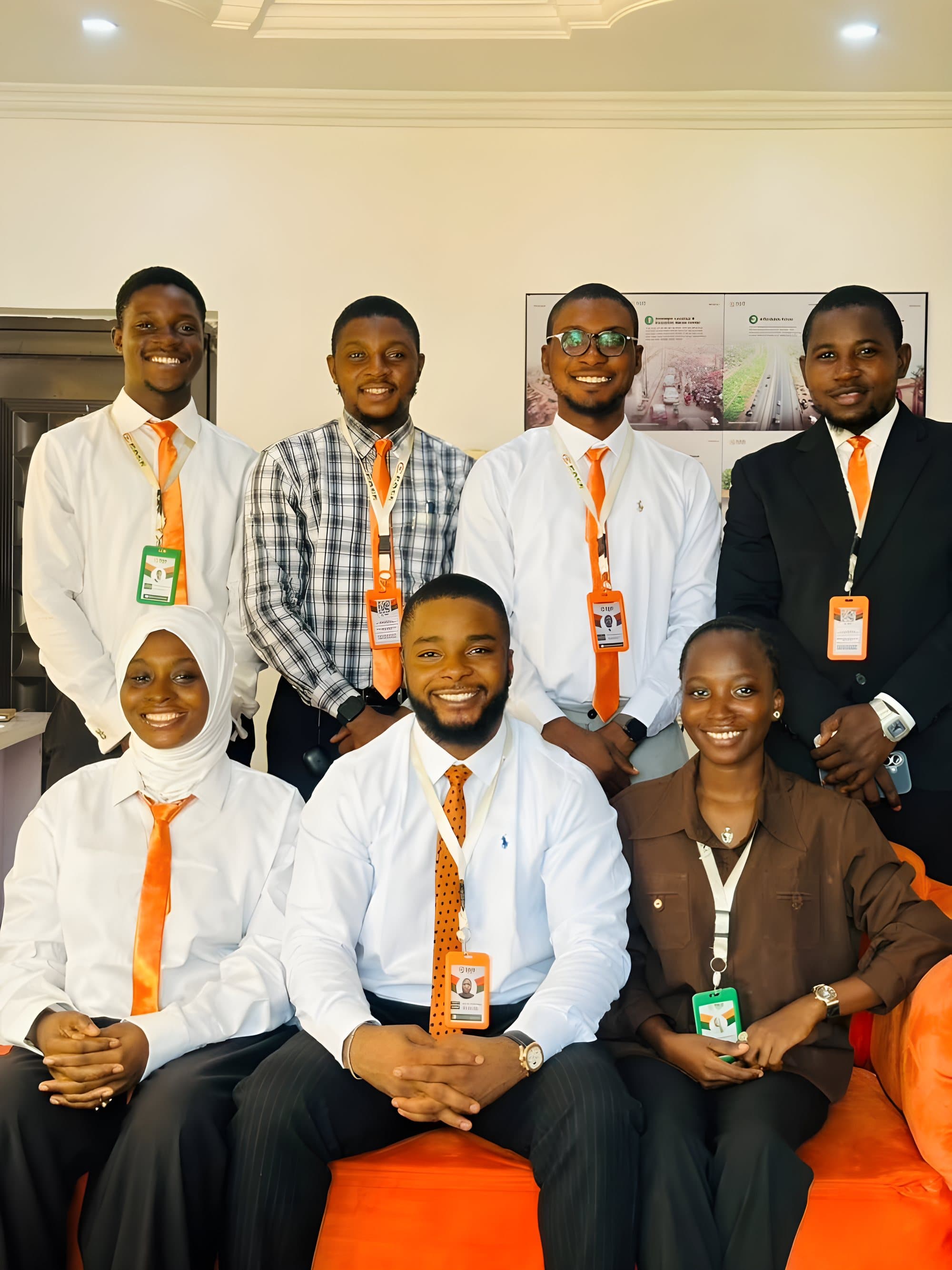The Pace Consults team in white shirts and orange ties