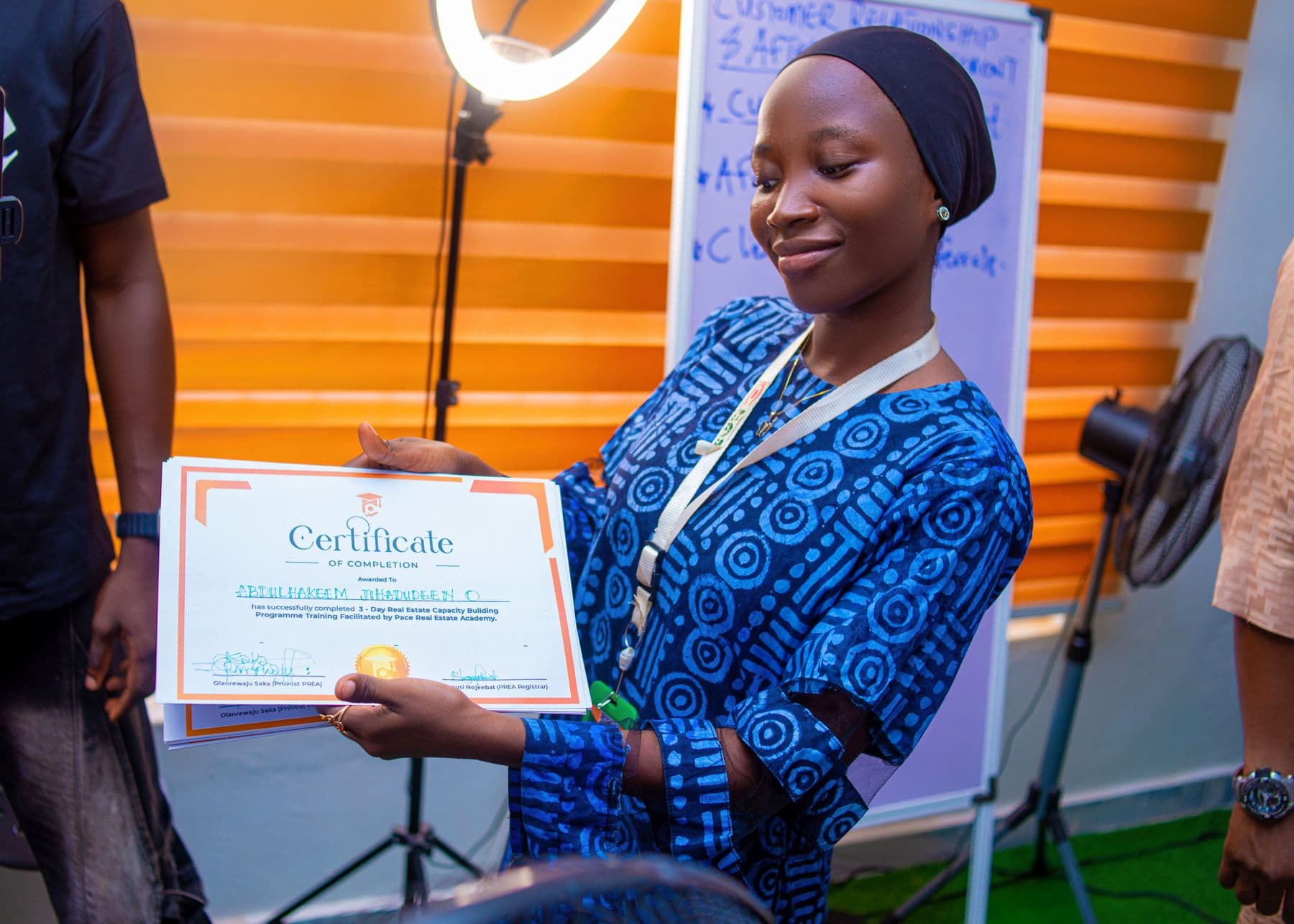 A graduate receiving her certificate