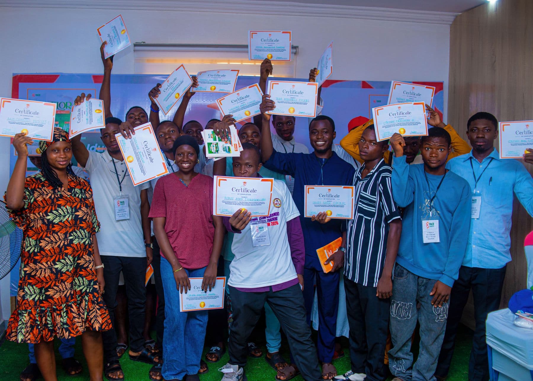 An Academy cohort celebrating with their certificates