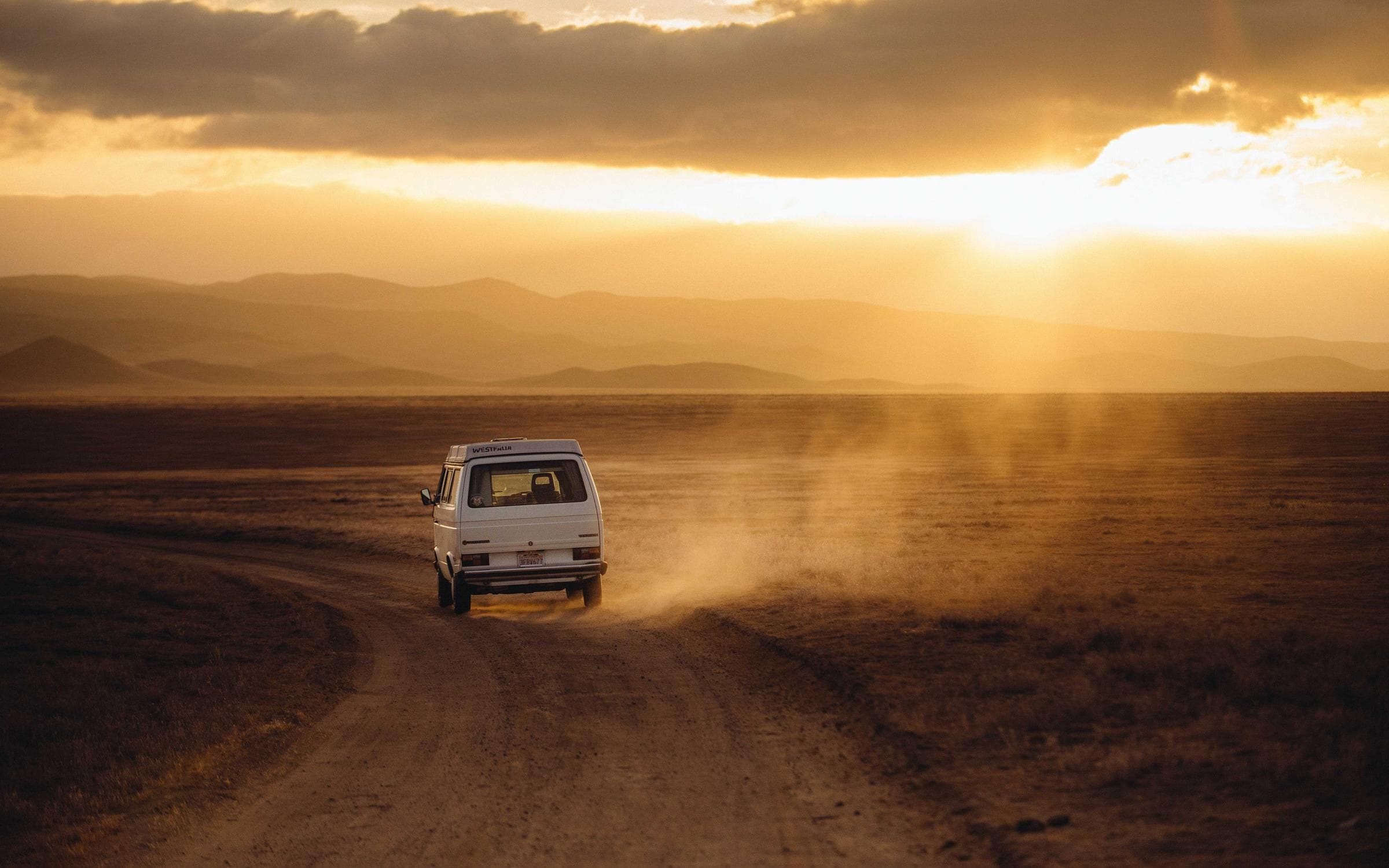 A road towards open land at sunset