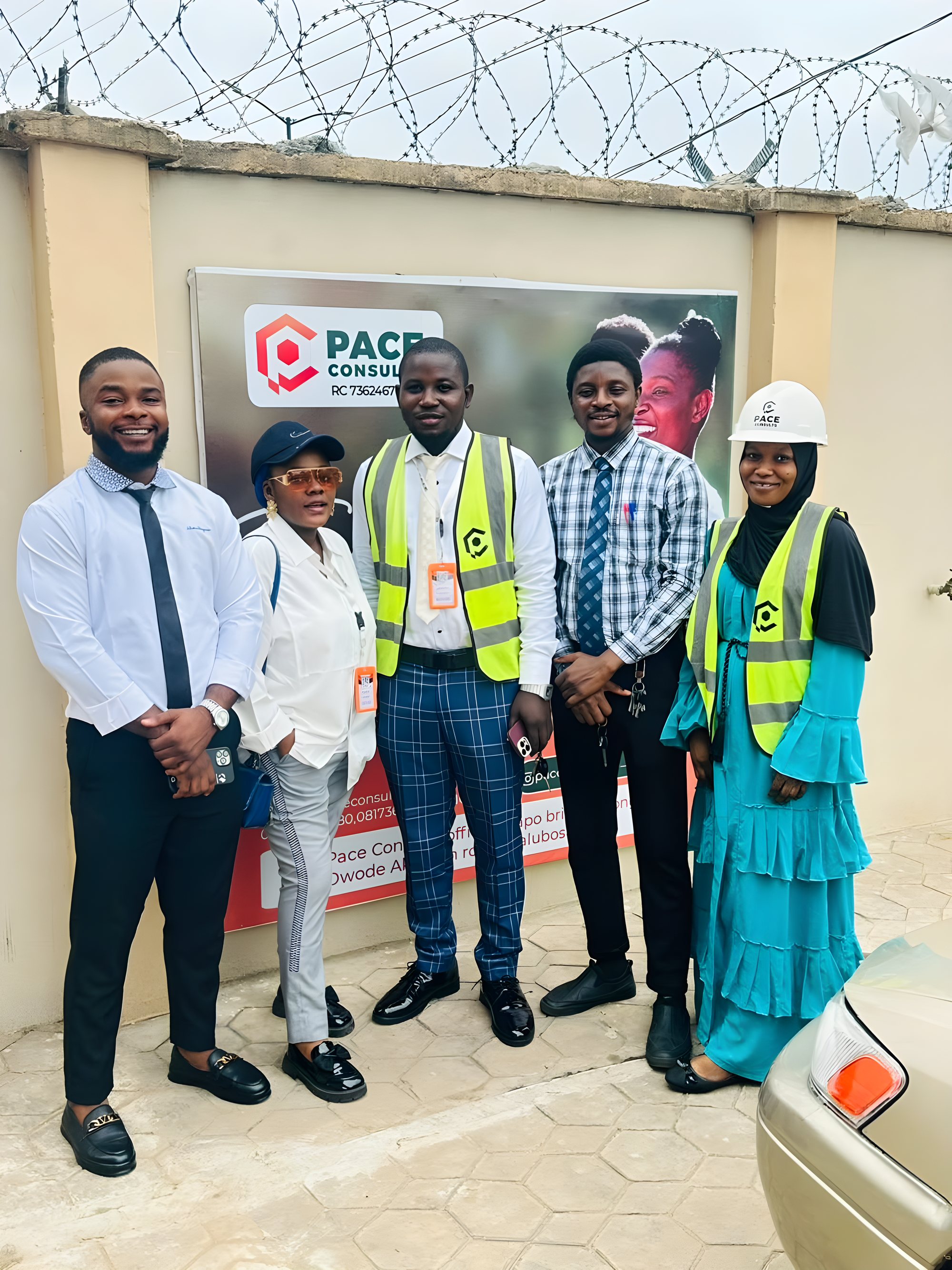 The Pace team in hi-vis vests outside the office